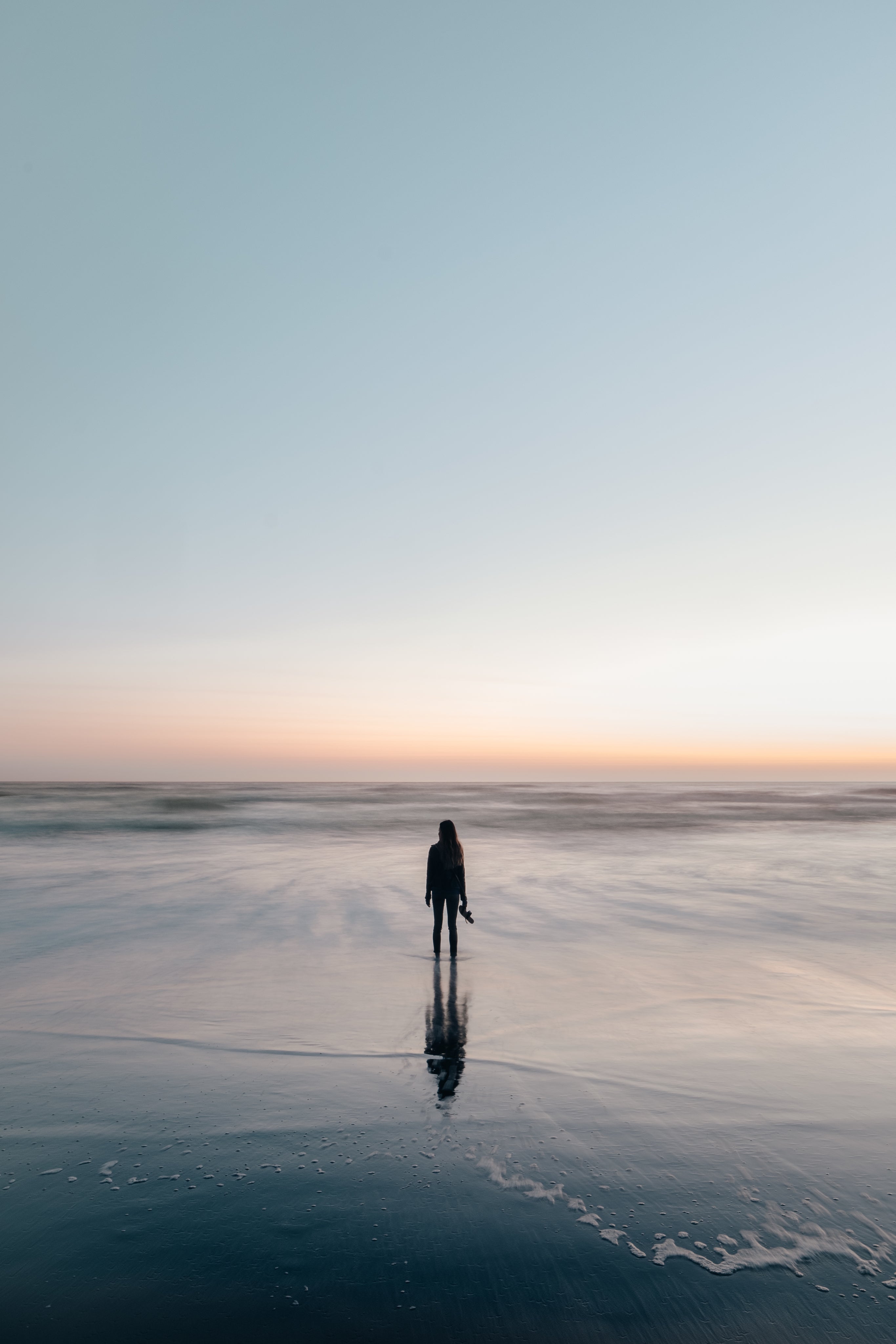 files/woman-wades-in-ocean-at-sunset.jpg